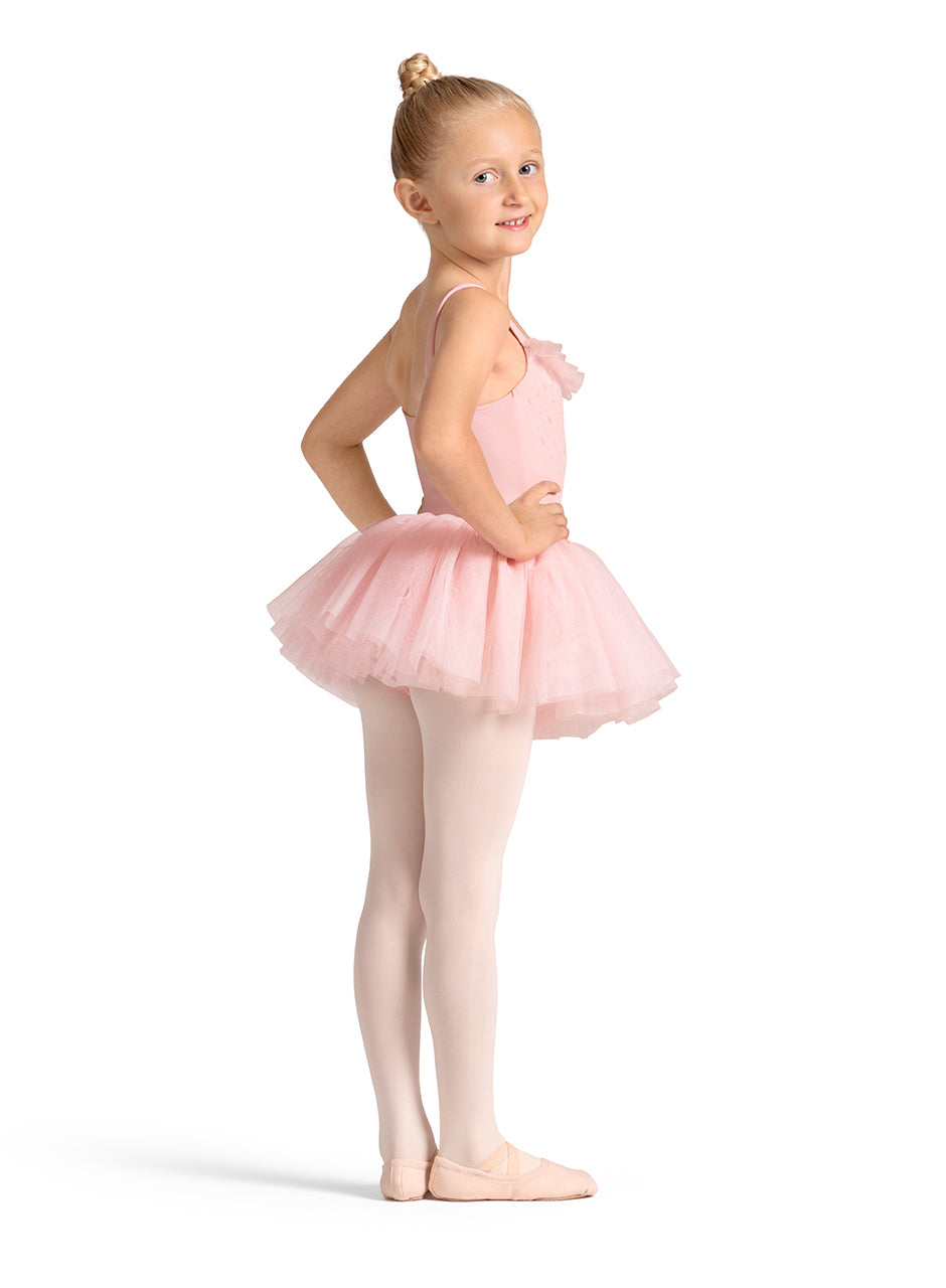 Young girl in a pink ballet outfit on a white background