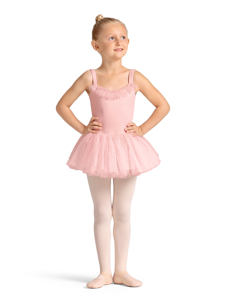 Young girl in a pink ballet dress on a white background