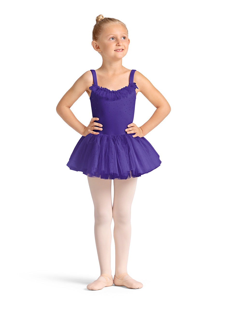 Young girl in a purple ballet dress on a white background