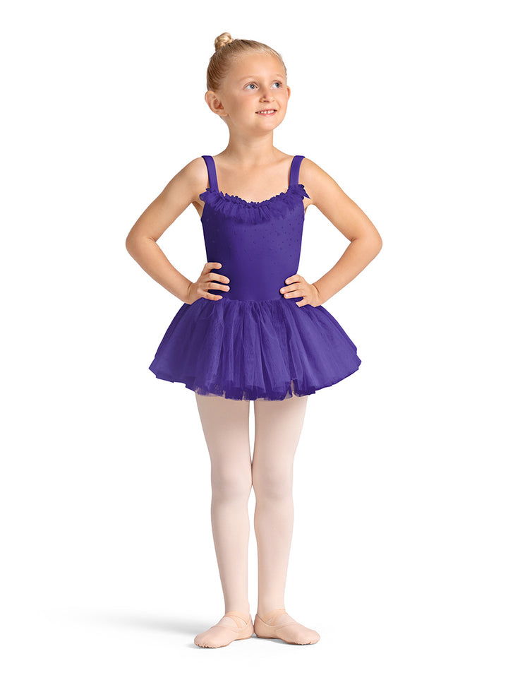 Young girl in a purple ballet dress on a white background