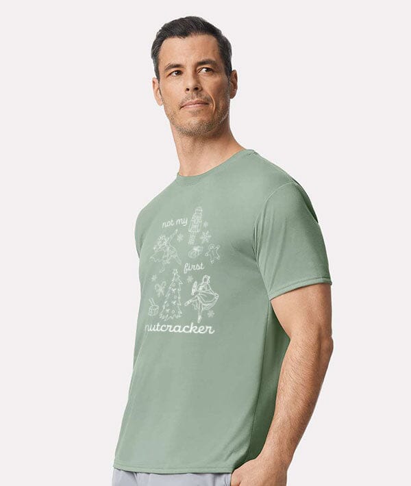 Man wearing a green t-shirt with a graphic design on a white background