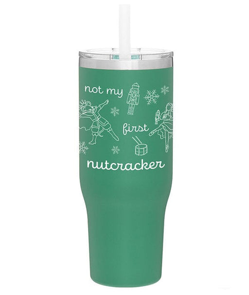Green tumbler with white text and illustrations on a white background