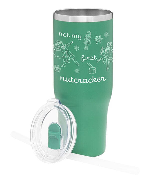 Green tumbler with 'not my first nutcracker' text and illustrations on a white background