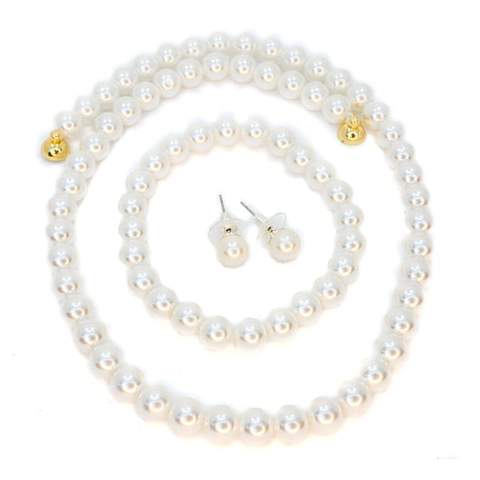 Pearl necklace and earrings set on a white background