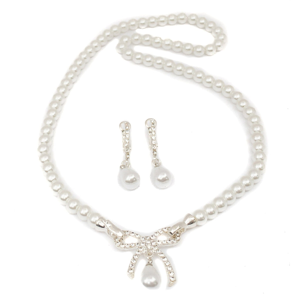 Pearl necklace with matching earrings on a white background