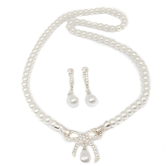 Pearl necklace with matching earrings on a white background
