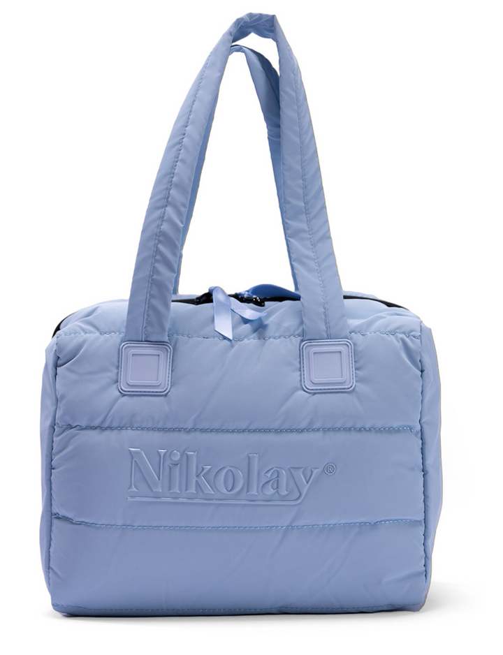 Blue quilted tote bag with 'Nikolay' branding on a white background