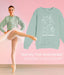 Woman in ballet outfit with 'Not My First Nutcracker' sweatshirt on pink background