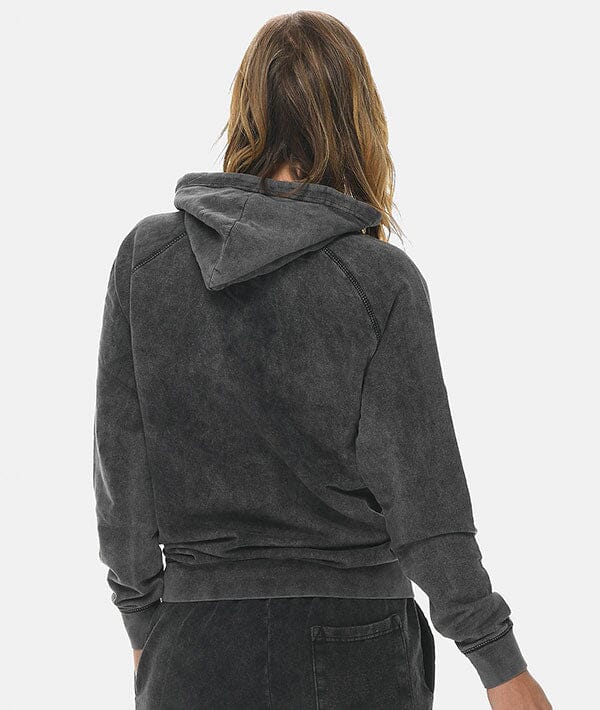 Female with facing away showing the back of the hoodie