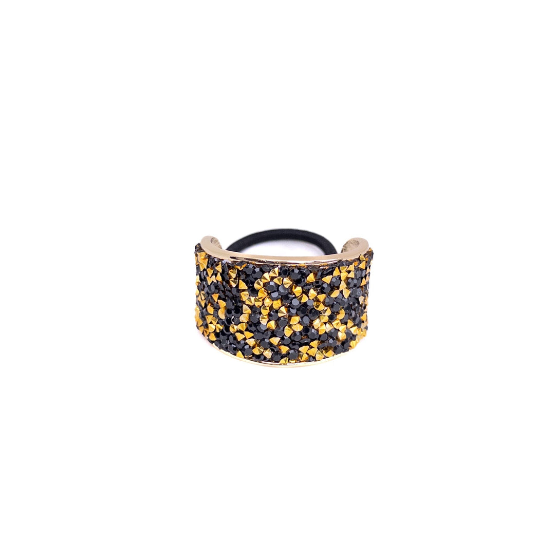 Bracelet with black and gold pattern on a white background