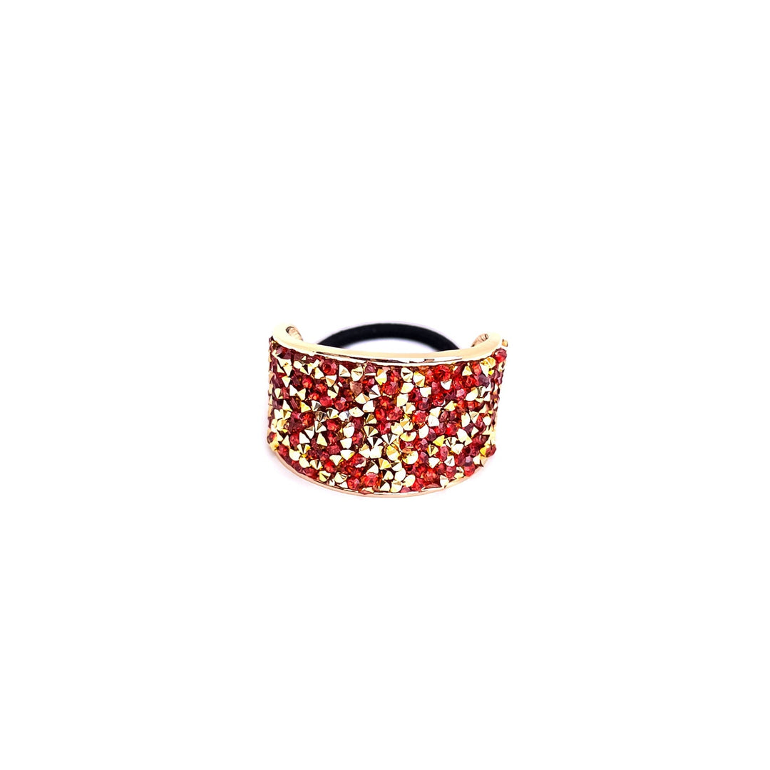 Gold and red bracelet on a white background