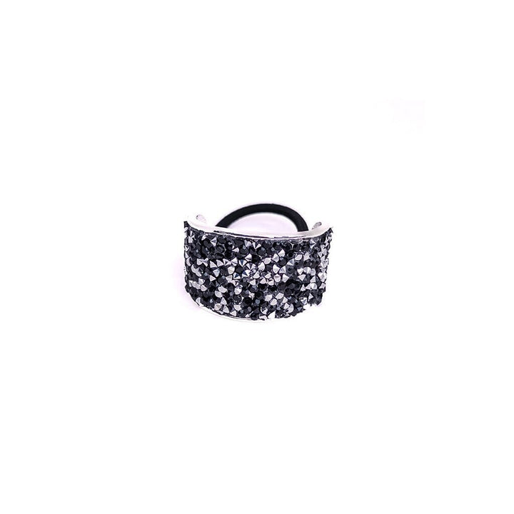 Black glittery hair tie on a white background
