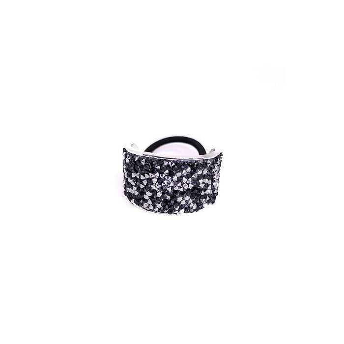 Black glittery hair tie on a white background
