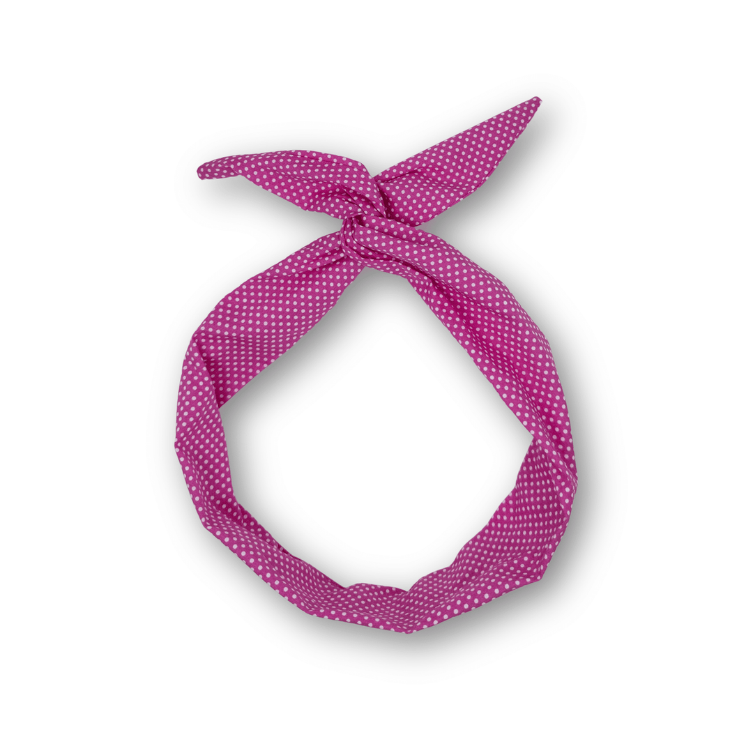 Pink polka dot headband on a white background
