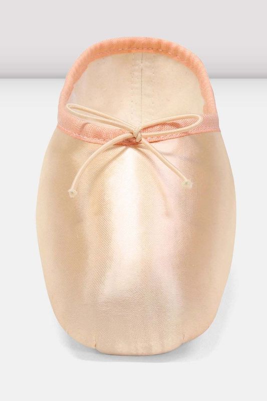 A single satin ballet pointe shoe in pale peach pink with a matching elastic ankle band and tied bow, shown from the front on a light gray background.