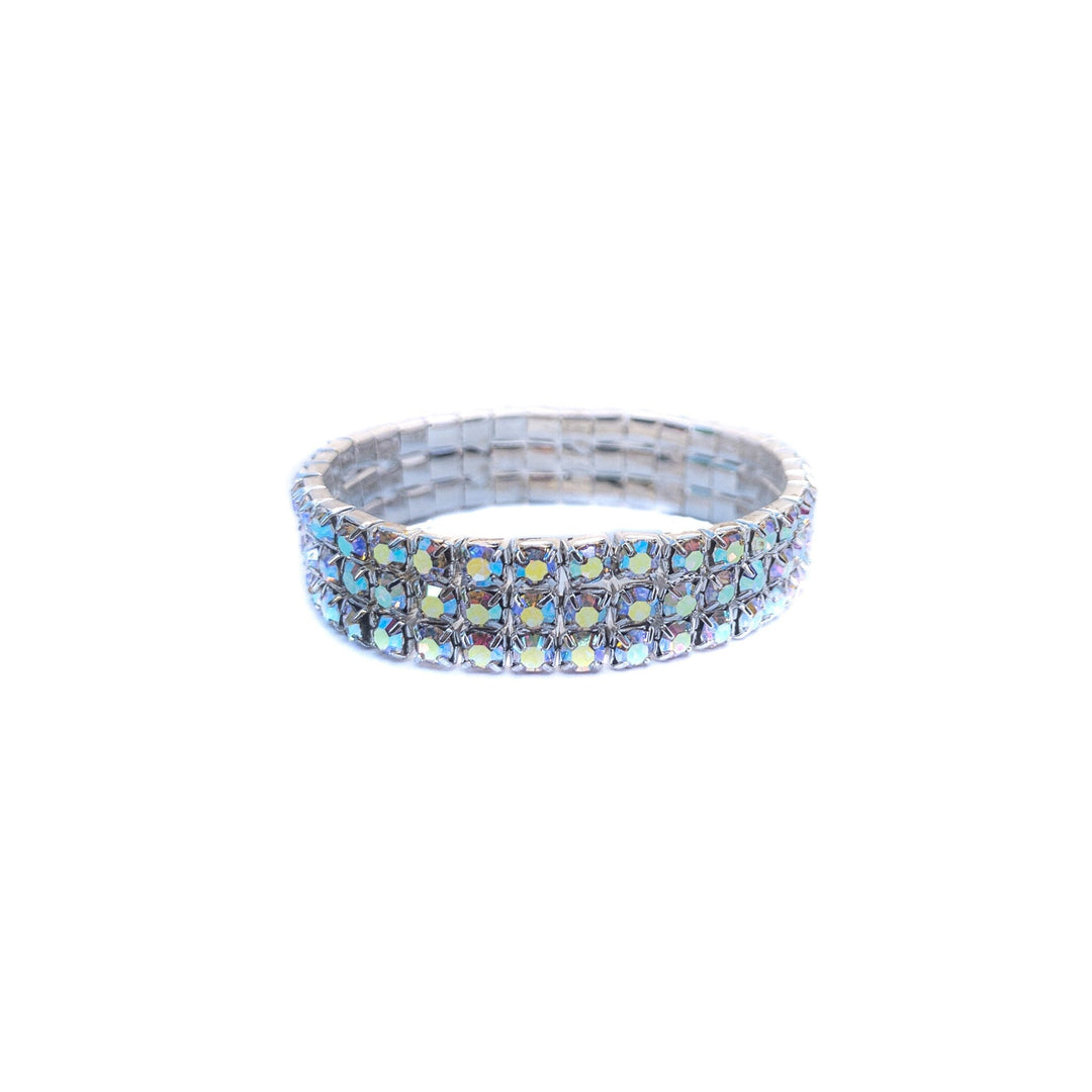 Silver ring with blue gemstones on a white background