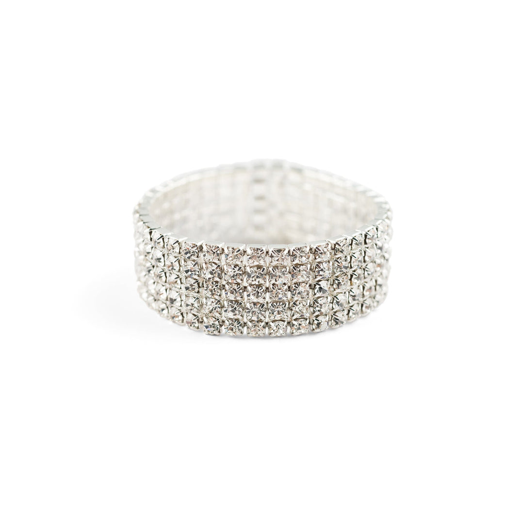 Silver ring with clear gemstones on a white background