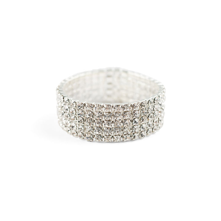 Silver ring with clear gemstones on a white background
