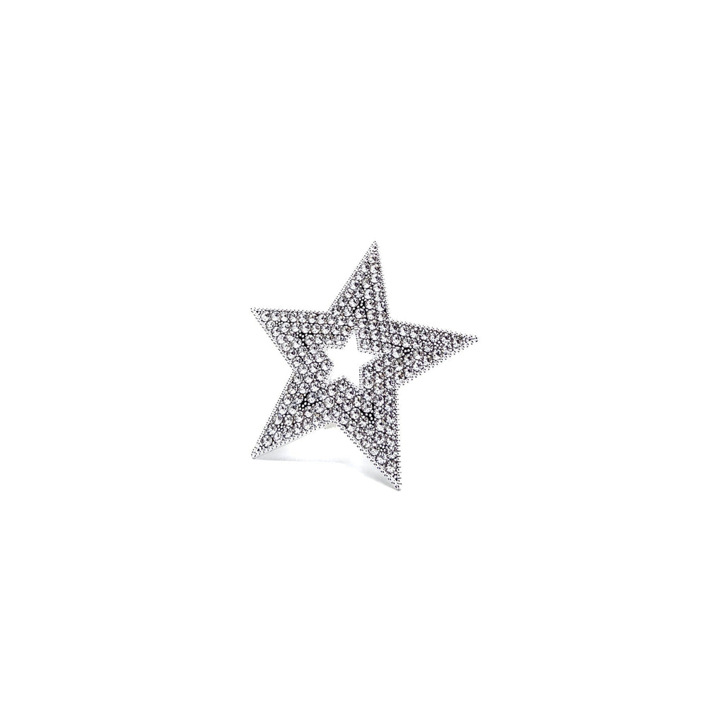 Star-shaped jewelry piece with embedded stones on a white background