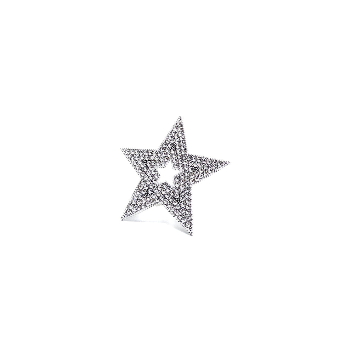 Star-shaped jewelry piece with embedded stones on a white background