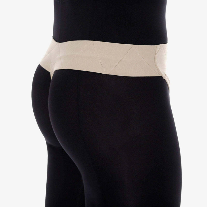 Black leggings with a beige waistband on a white background