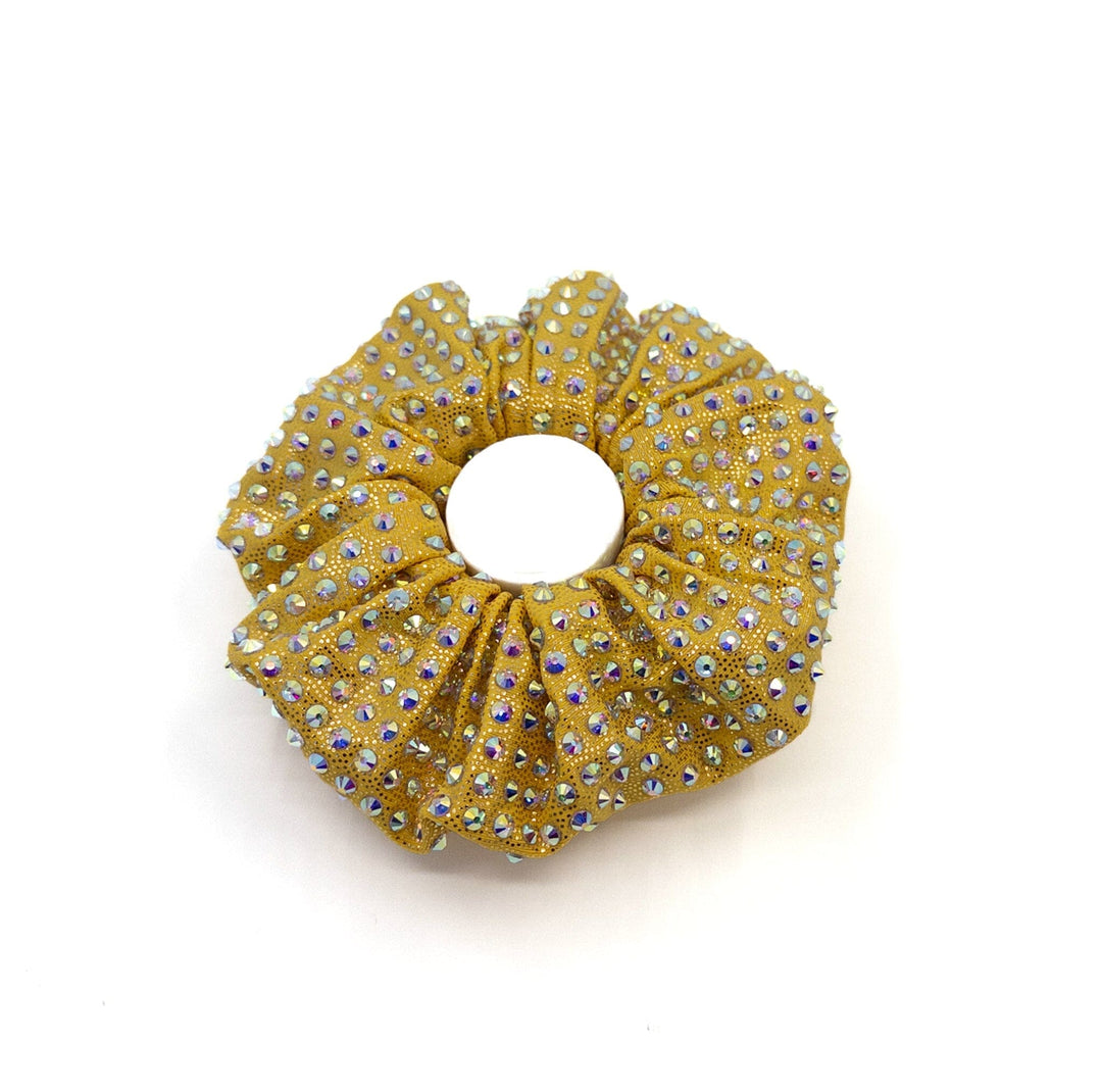 Gold scrunchie with rhinestones on a white background