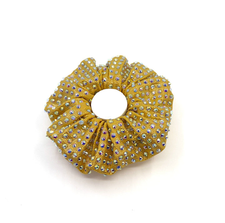 Gold scrunchie with rhinestones on a white background