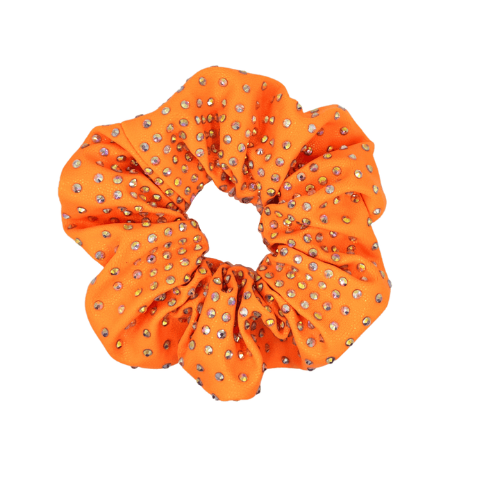 Orange scrunchie with rhinestone embellishments on a white background