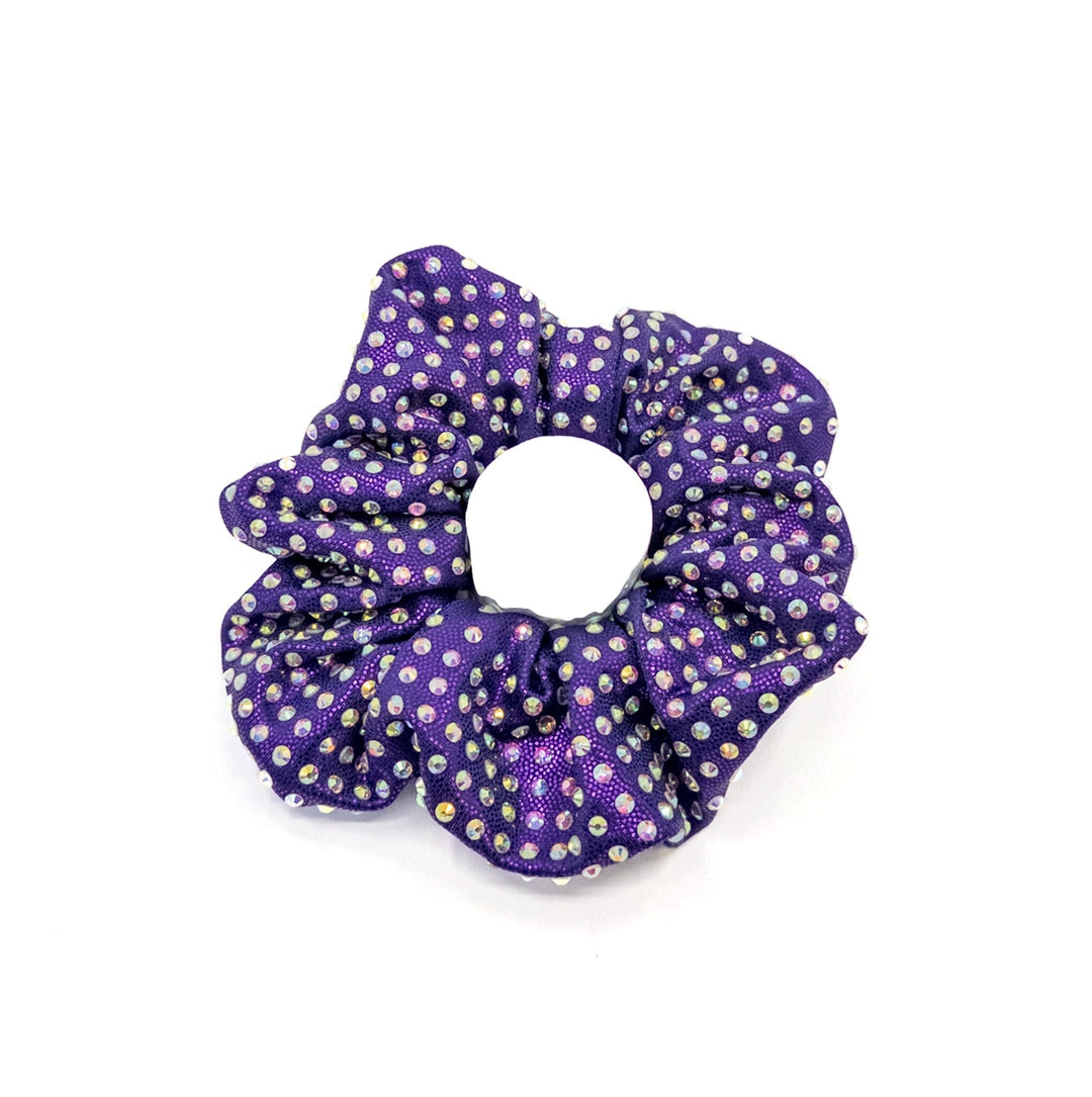 Purple scrunchie with gold polka dots on a white background