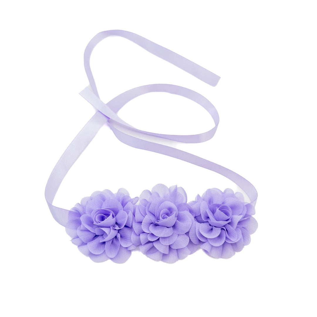Lavender headband with floral decorations on a white background