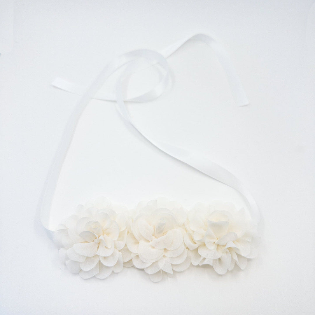White dress with a large bow on a white background