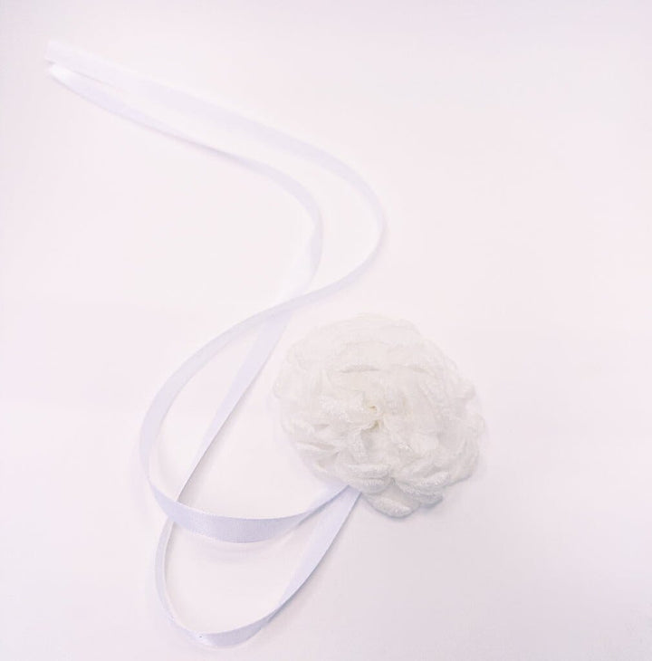 White flower hair clip on a white background