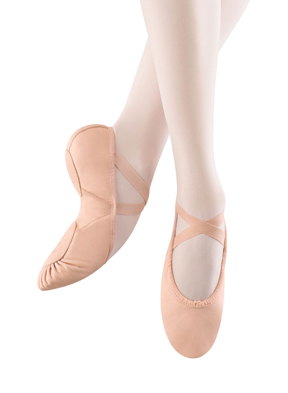 Ballet shoes with white tights on a white background