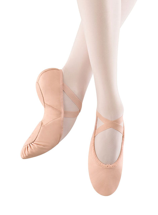 Ballet shoes with white tights on a white background