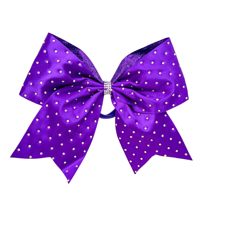 Purple polka dot bow with rhinestones on a white background