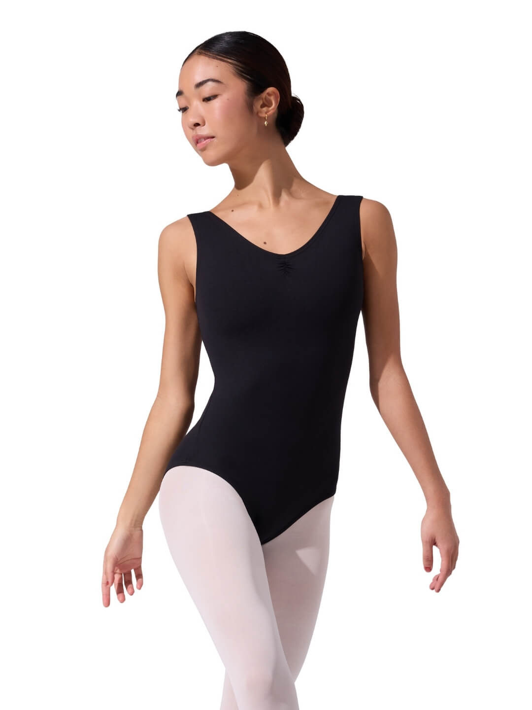 Person wearing a black tank leotard and white tights on a white background