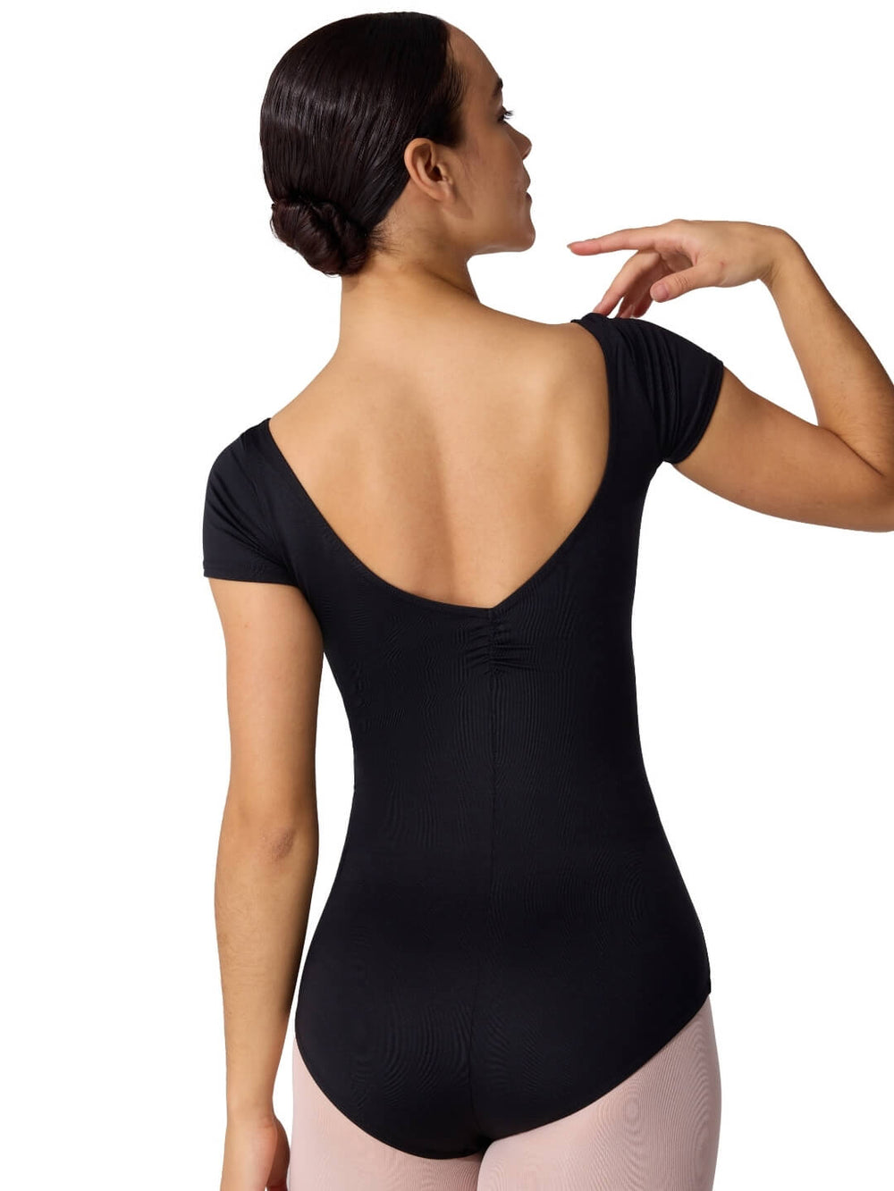 Woman wearing a black short-sleeve leotard on a white background