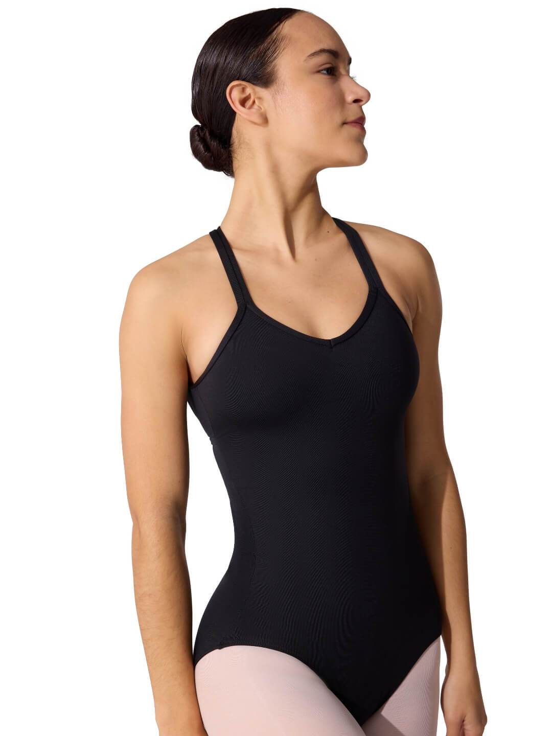 Woman wearing a black leotard on a white background