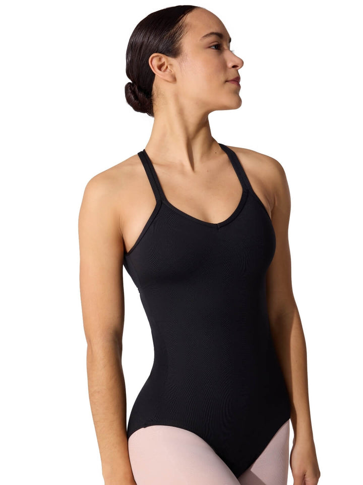 Woman wearing a black leotard on a white background