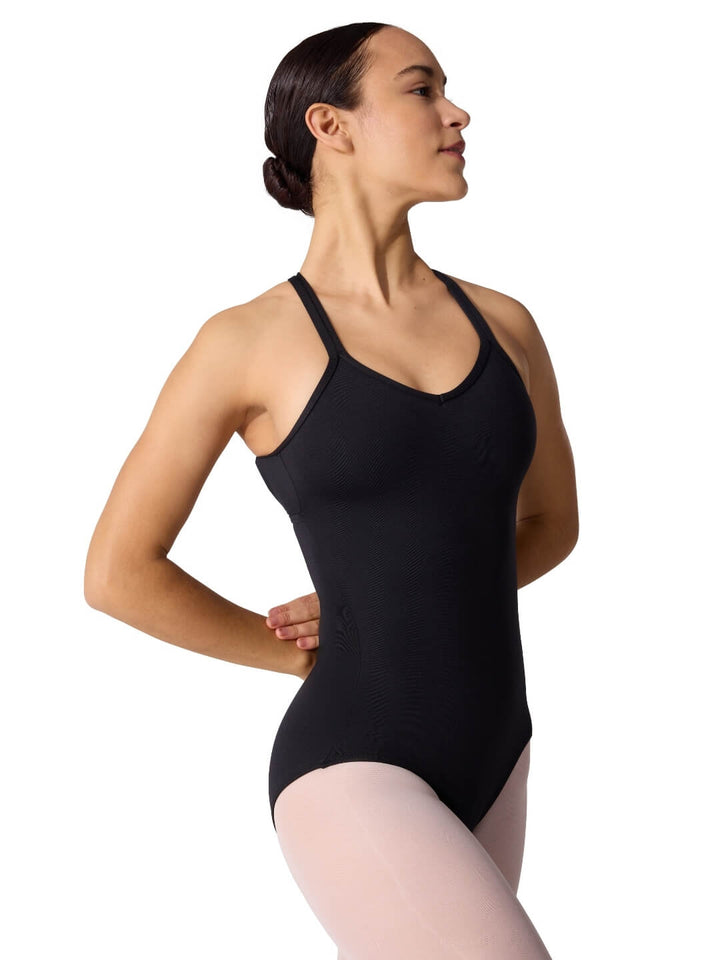 Woman wearing a black leotard on a white background