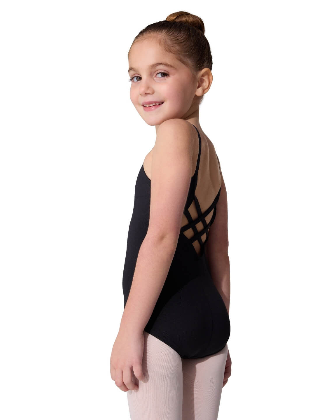 Young girl wearing a black leotard with cut-out design on a white background