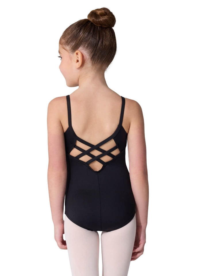 Young girl wearing a black leotard with criss-cross back design on a white background