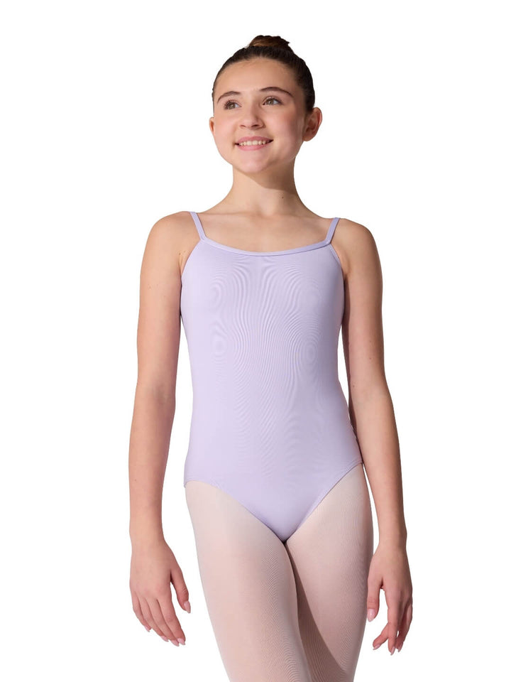 Young girl wearing a lavender leotard on a white background