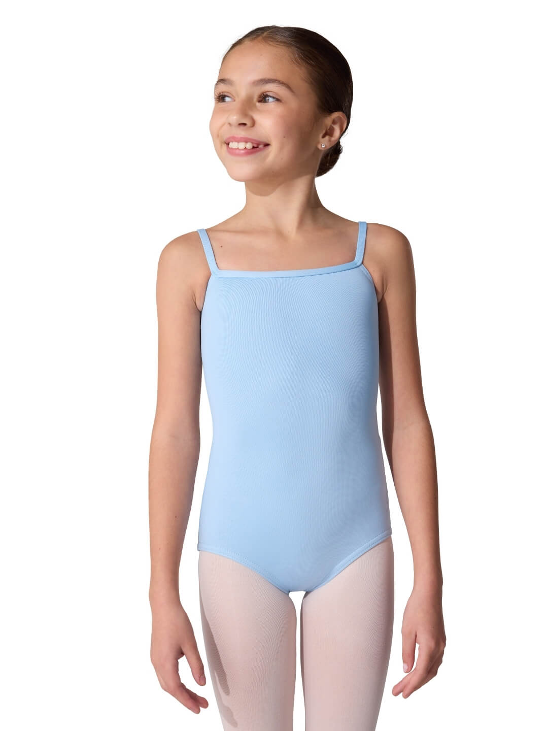 Young girl wearing a light blue leotard on a white background