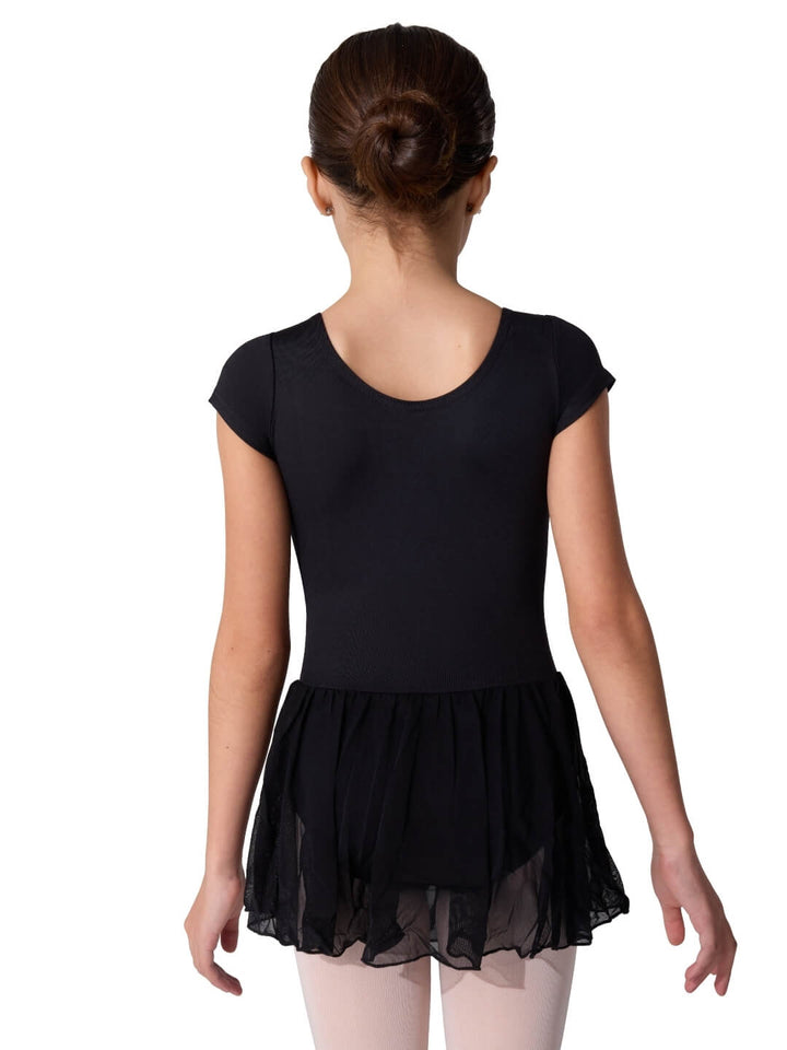 Young girl wearing a black ballet dress on a white background