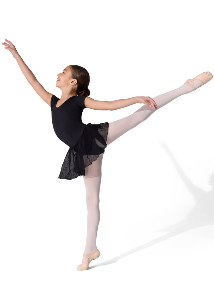 Ballerina in a black leotard and tights posing on a white background