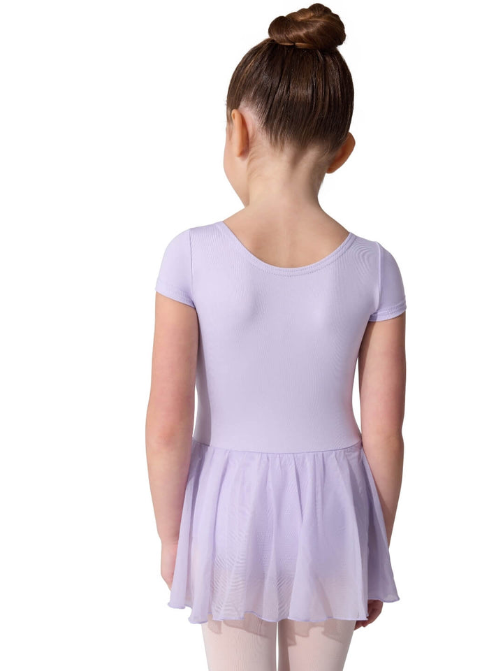 Young girl wearing a light purple dress on a white background