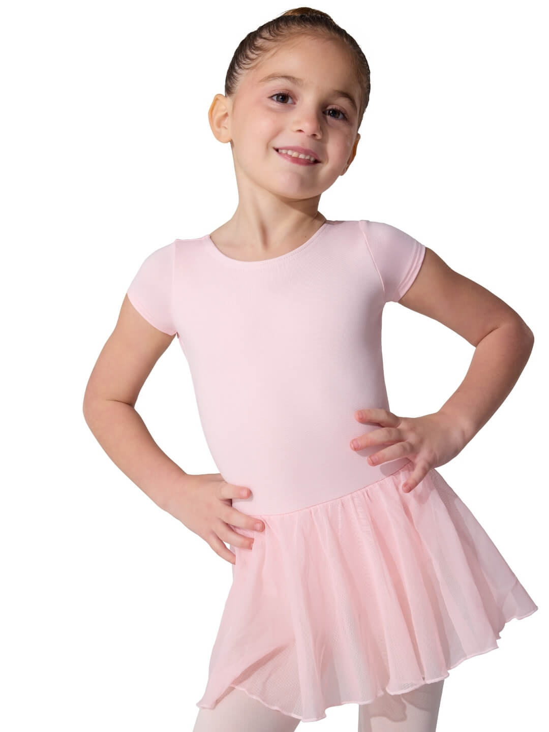 Young girl wearing a pink ballet dress on a white background