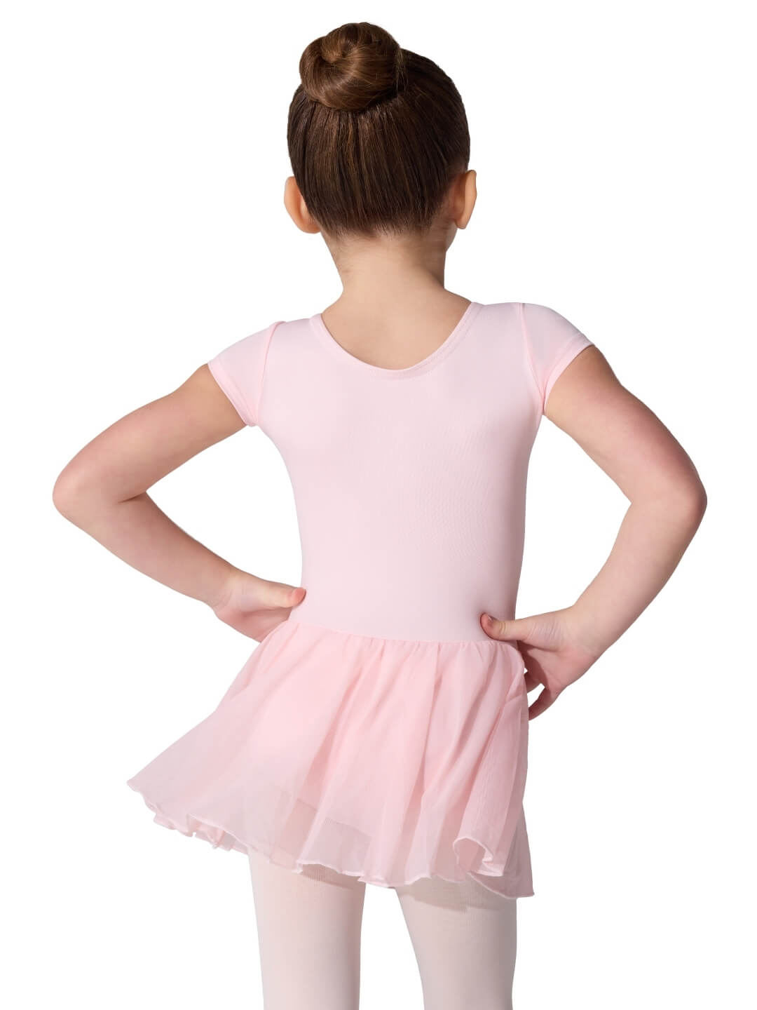Young girl wearing a pink ballet dress on a white background