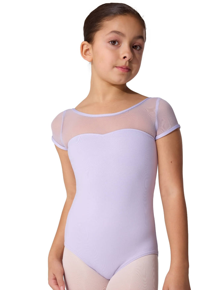 Young girl wearing a light purple leotard with sheer sleeves on a white background